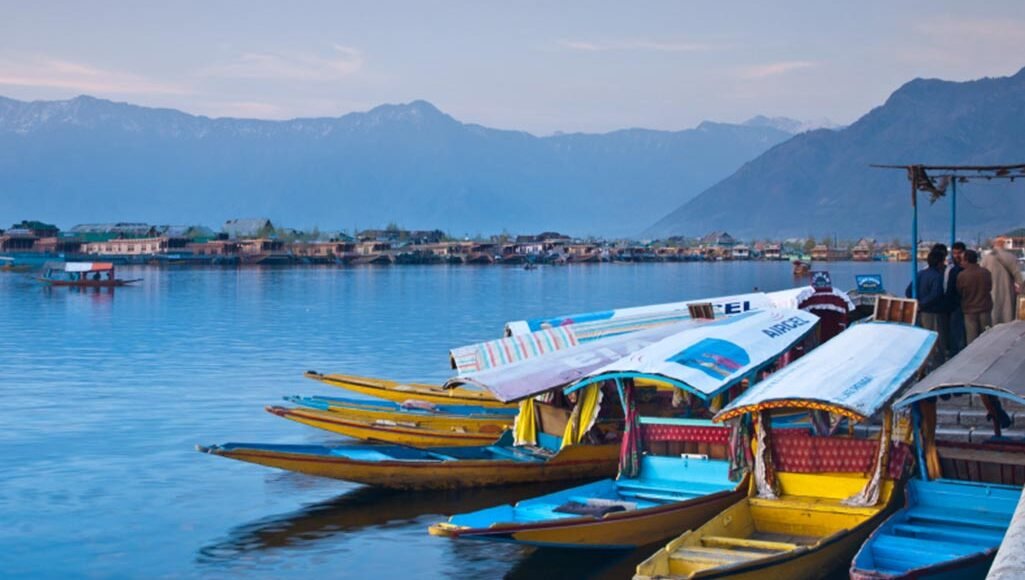 Dal Lake, a freshwater lake in Srinagar, surrounded by houseboats and shikaras with Sky planet holidays